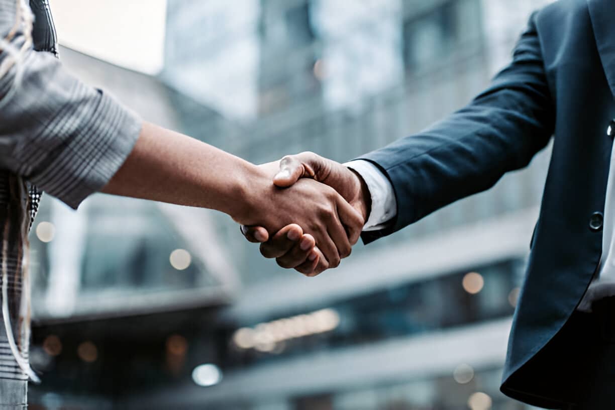 a close-up of a man shaking hands